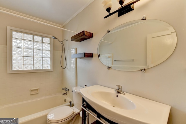 full bath featuring washtub / shower combination, a sink, crown molding, and toilet