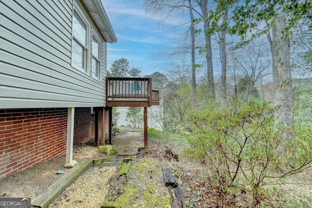 view of yard with a wooden deck