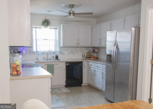 kitchen with tasteful backsplash, light countertops, a sink, stainless steel fridge, and dishwasher