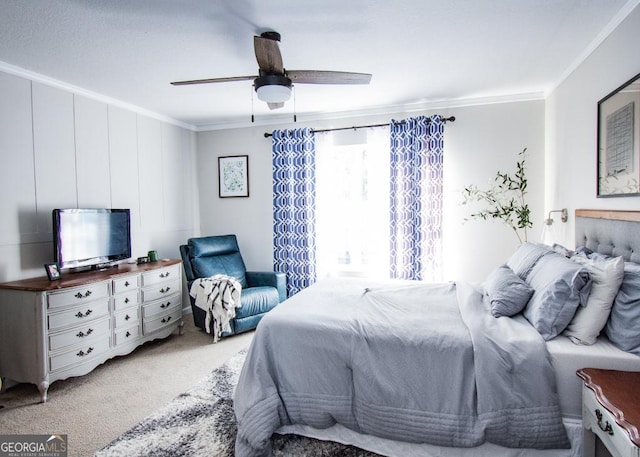 bedroom featuring a ceiling fan, crown molding, and light colored carpet