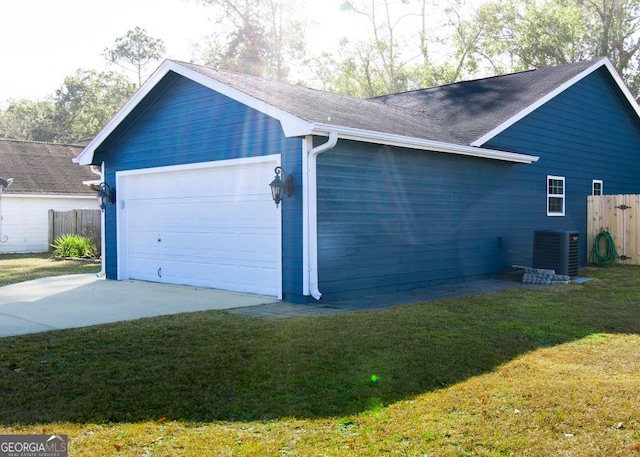 view of home's exterior with central air condition unit, a garage, fence, and a lawn