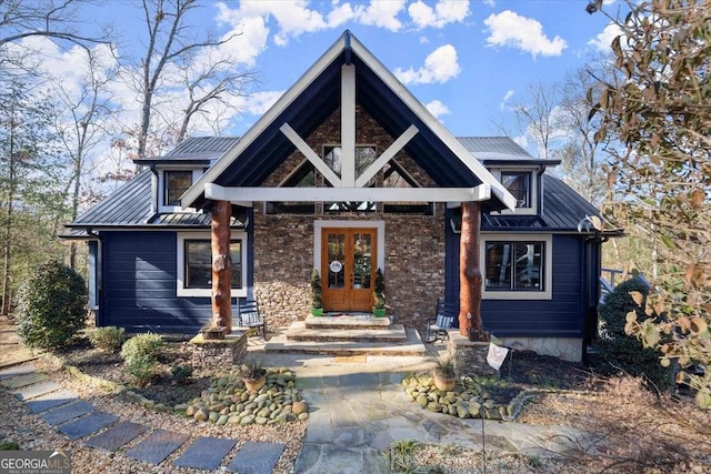 view of front of house with french doors, metal roof, and a standing seam roof