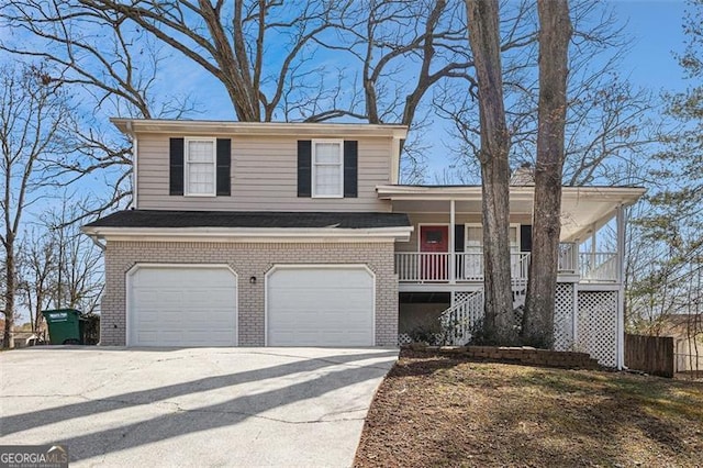 split level home with a porch, brick siding, driveway, and an attached garage