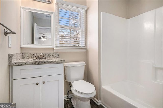 3822 Holland Dr, Snellville, GA 30039 - bathroom featuring bathtub / shower combination, baseboards, vanity, and toilet