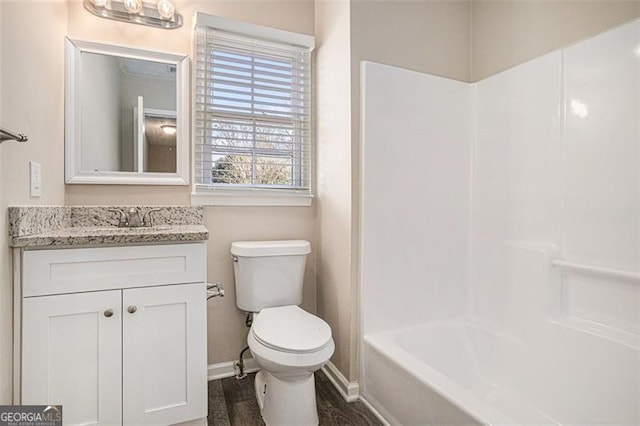 3822 Holland Dr, Snellville, GA 30039 - bathroom with  shower combination, baseboards, vanity, and toilet