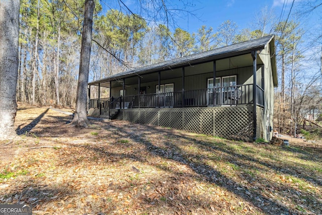 view of property exterior with covered porch