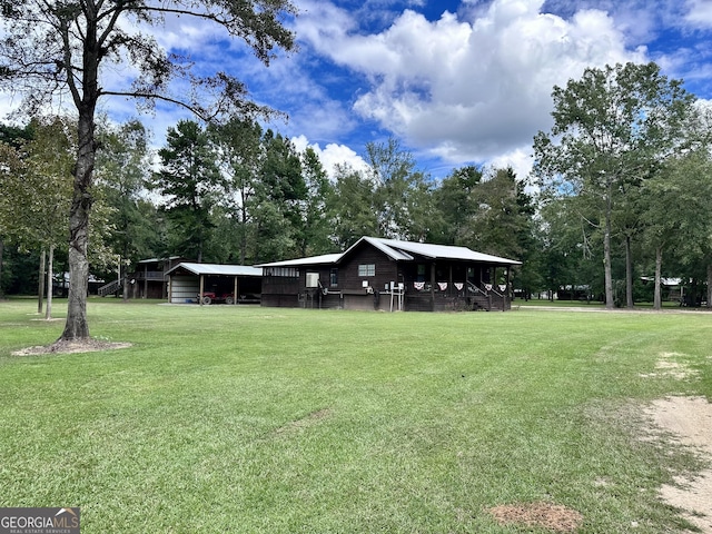 view of property's community with a yard