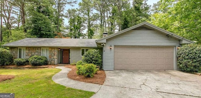 ranch-style home with a front yard, stone siding, driveway, and an attached garage