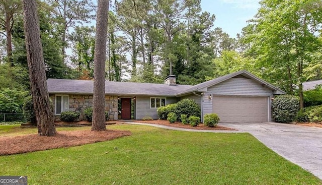 single story home with a garage, stone siding, driveway, and a front yard