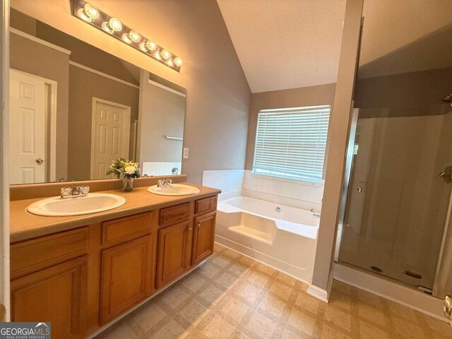 bathroom with a garden tub, a sink, a shower stall, and tile patterned floors