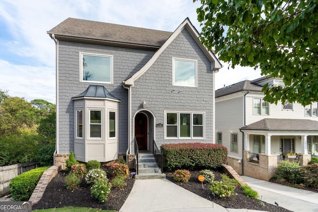 view of front of home featuring fence