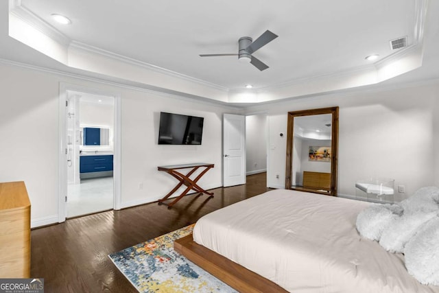 bedroom featuring visible vents, baseboards, dark wood-style floors, a raised ceiling, and crown molding