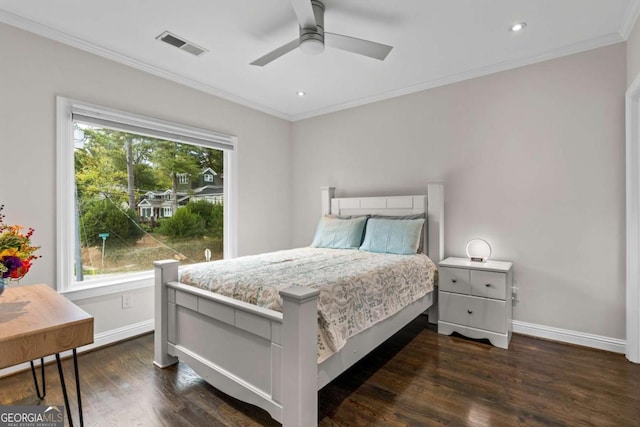 bedroom with baseboards, visible vents, dark wood-style flooring, and ornamental molding