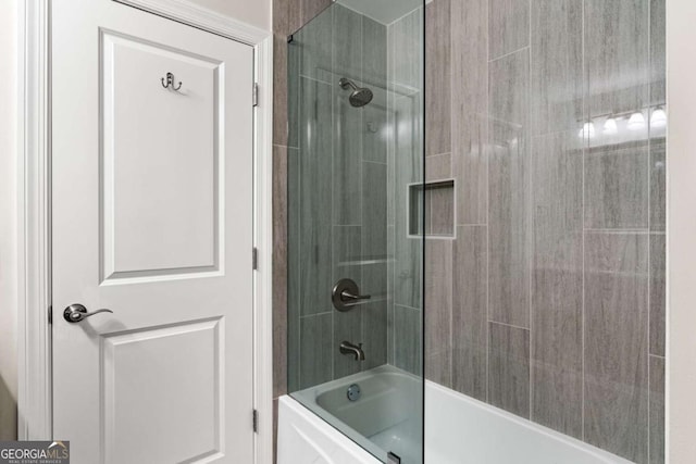 full bathroom featuring bath / shower combo with glass door