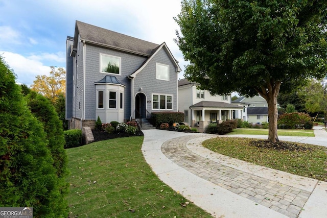 traditional-style home with a front lawn