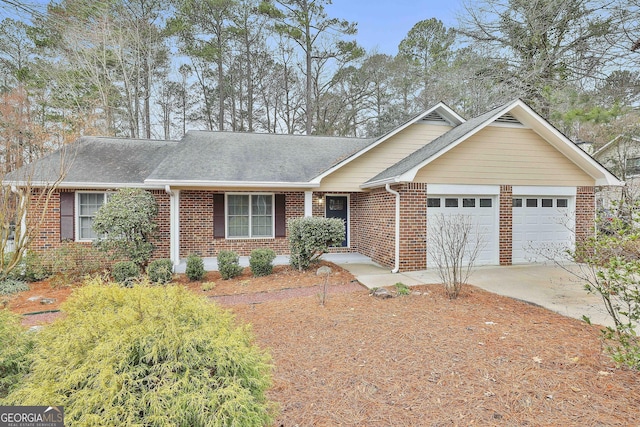 ranch-style home featuring a garage, concrete driveway, brick siding, and a shingled roof