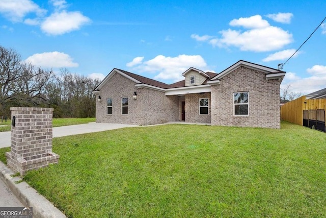 single story home with concrete driveway, brick siding, a front yard, and fence