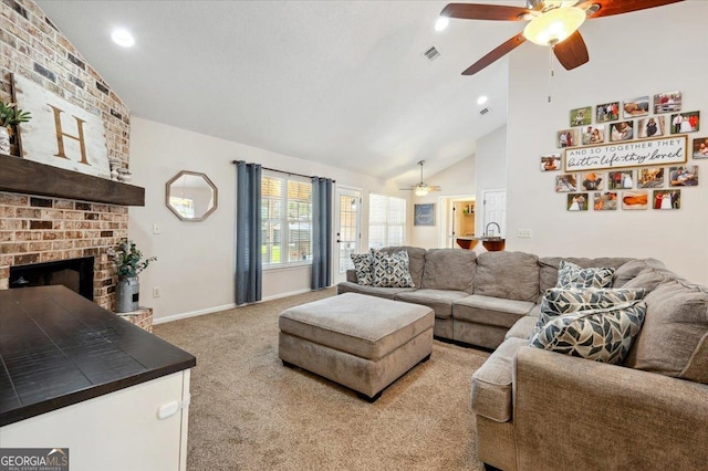 living room featuring high vaulted ceiling, visible vents, baseboards, a brick fireplace, and carpet