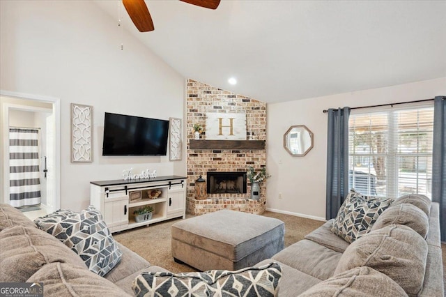 living area with baseboards, light colored carpet, ceiling fan, a fireplace, and high vaulted ceiling