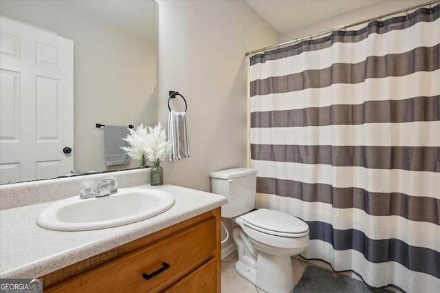 bathroom featuring toilet, curtained shower, vanity, and tile patterned floors