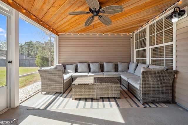 sunroom with wooden ceiling and a ceiling fan