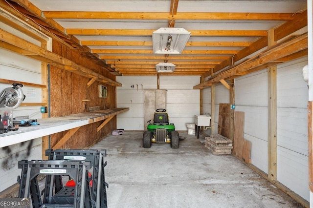 storage room featuring a garage and a sink