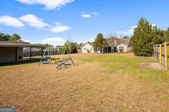 view of yard featuring a fenced backyard and a playground