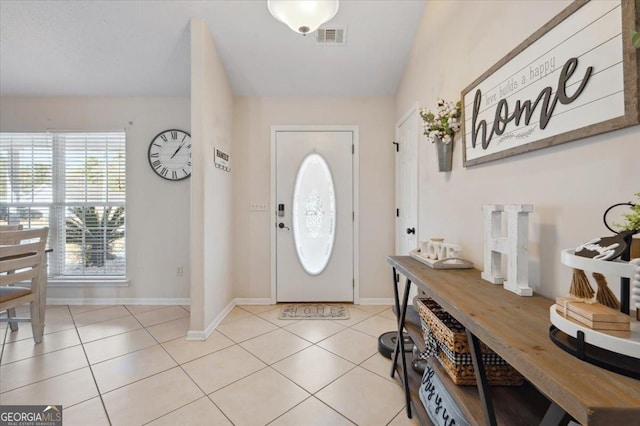 entryway featuring visible vents, baseboards, and light tile patterned floors