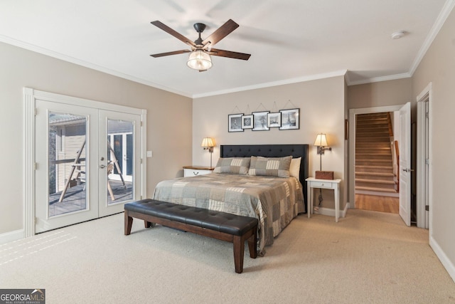 bedroom featuring access to outside, light colored carpet, crown molding, and french doors