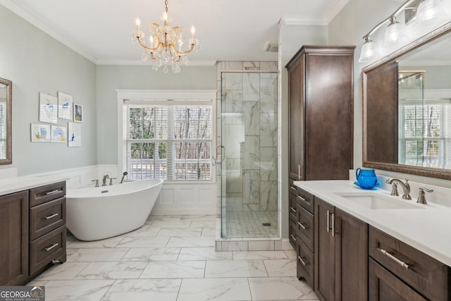 full bathroom featuring vanity, marble finish floor, wainscoting, a shower stall, and crown molding