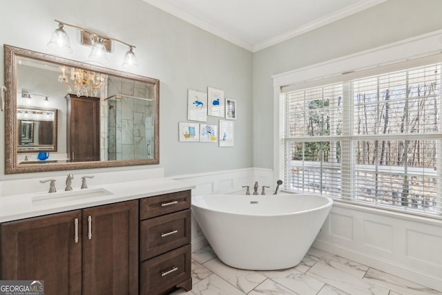 full bathroom featuring a wainscoted wall, vanity, marble finish floor, ornamental molding, and a shower stall