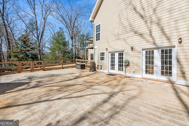 view of patio / terrace with central AC unit and french doors