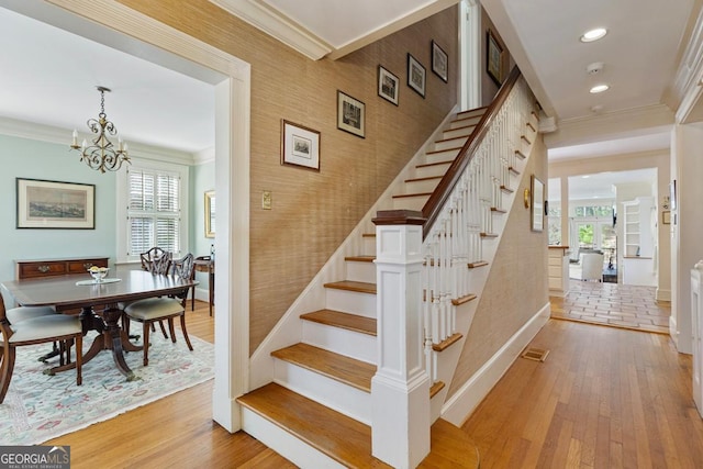 staircase featuring baseboards, recessed lighting, wood finished floors, and crown molding