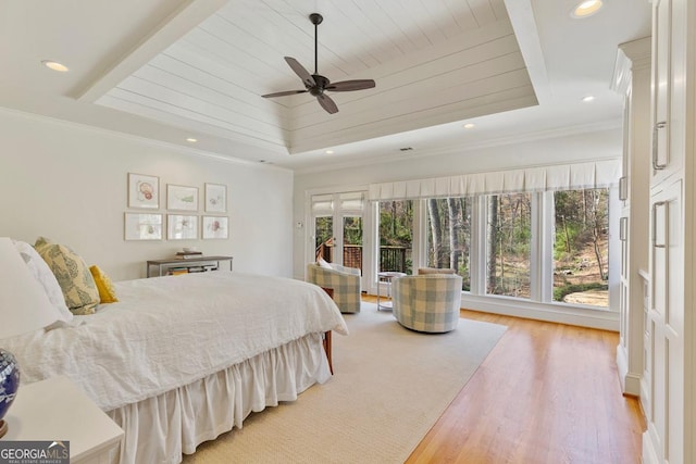 bedroom with a tray ceiling, crown molding, recessed lighting, light wood-style flooring, and wood ceiling