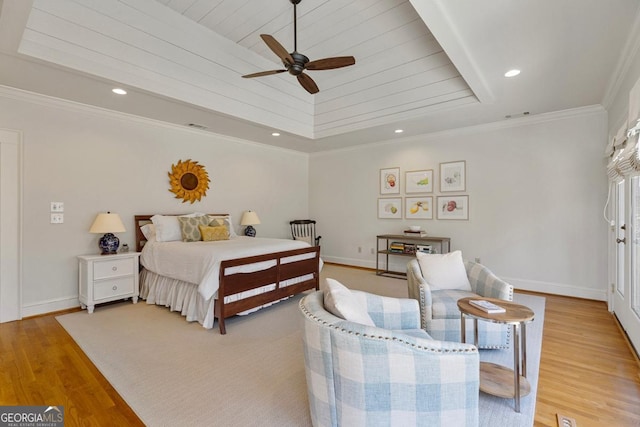 bedroom with light wood-style floors, baseboards, crown molding, and recessed lighting