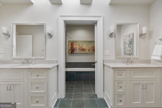 bathroom featuring tile patterned flooring, two vanities, and a sink