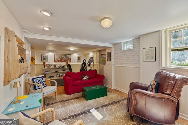 living area with a wainscoted wall