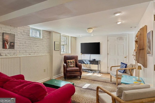 living area featuring a wainscoted wall