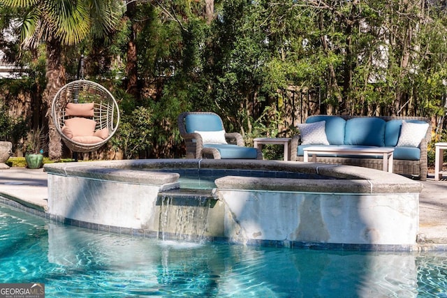 outdoor pool featuring an outdoor living space