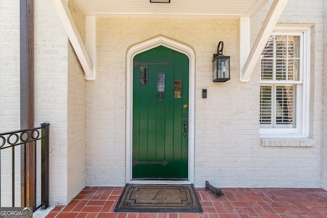 entrance to property with brick siding