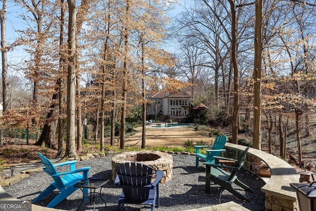 view of yard featuring a patio and a fire pit