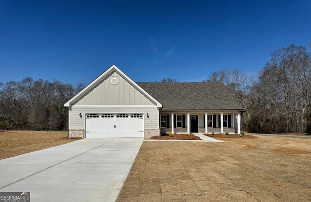 view of front of home featuring a shingled roof, concrete driveway, an attached garage, a porch, and board and batten siding