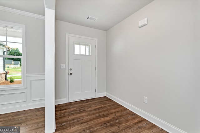 entryway featuring dark wood-style flooring, visible vents, and baseboards