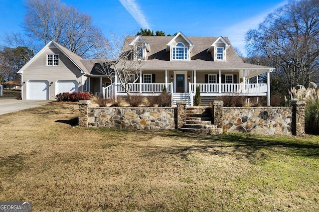 view of front facade with a garage, covered porch, stairway, and a front lawn