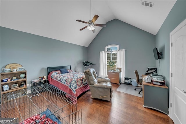 bedroom with high vaulted ceiling, a ceiling fan, visible vents, and wood finished floors