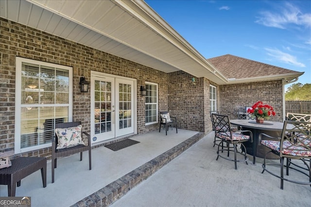 view of patio with outdoor dining area and french doors