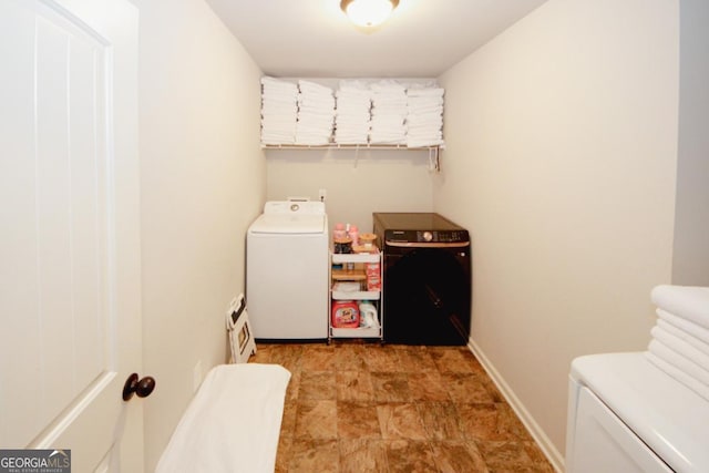 laundry room with laundry area, independent washer and dryer, and baseboards