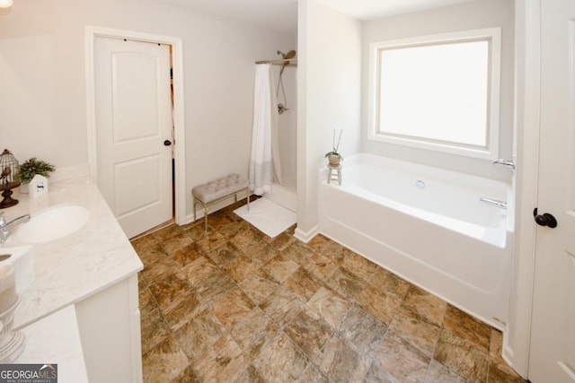 bathroom with a shower with shower curtain, a bath, and vanity