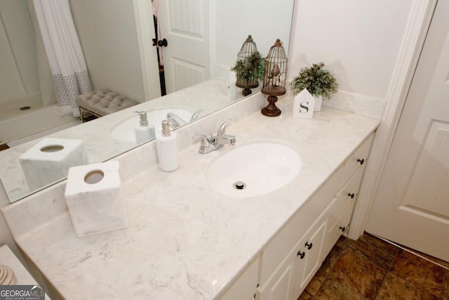 bathroom with vanity and a shower with shower curtain