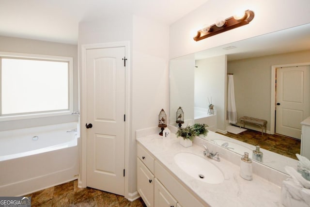 full bathroom featuring vanity and a bath